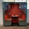 Stylish acoustic meeting pod with glass doors.